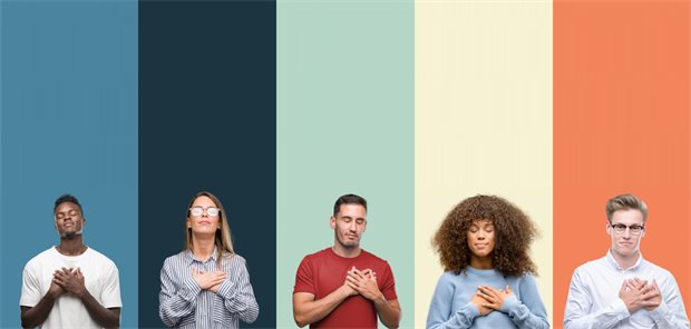 Group of people over vintage colors background smiling with hands on chest with closed eyes and grateful gesture on face. Health concept.