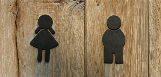 Symbol einer Frau und eines Mannes auf Holz.