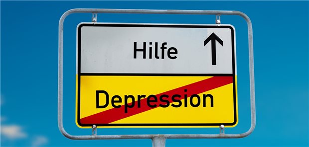 Ortsausgangsschild, bei dem man "Depression" gerade verlässt und in Richtung "Hilfe" weiterfährt.