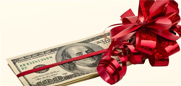 Geldschein mit Geschenkschleife darum