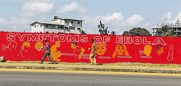 Mehr Vertrauen durch neue Kommunikationsstrategie? Ebola-Aufklärung in Monrovia: Typische Symptome werden symbolisch dargestellt.