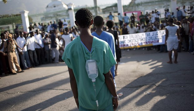 Medico international: Von Katastrophen hart gefordert Ein Jahr nach dem Erdbeben: Haitianer protestieren für den Wiederaufbau.