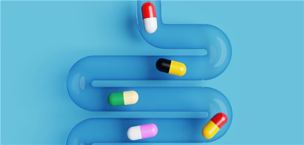 Antibiotika wirken sich offenbar langfristig auf das Darmmikrobiom aus Eine sehr einfache Illustration eines Darms mit verschiedenen Kapseln drin.