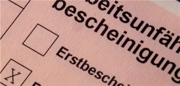 Symbolbild Nahaufnahme einer Arbeitsunfähigkeitsbescheinigung