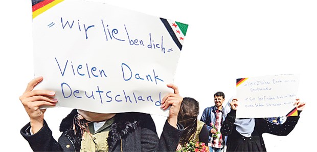 Thüringens Ärzte stellen sich ihrer Verantwortung Junge Frauen aus Syrien bedanken sich in Erfurt für die Hilfsbereitschaft.