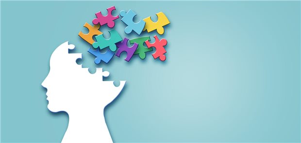 Ein Umriss eines Gesichts, dessen Kopf sich in viele Puzzleteile auflöst.