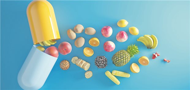 Aus einer überdimensionierten geöffneten Kapsel fällt Obst und Gemüse heraus. 