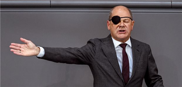 Klima-Ärzte fordern Scholz zum Handeln für saubere Luft auf Bundeskanzler Olaf Scholz mit Augenklappe im Bundestag.