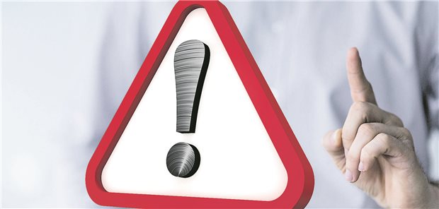 Erhobener Zeigefinder vor Warnschild